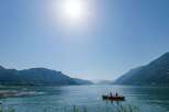 Enjoy a serene day on the lake with stunning mountain views.