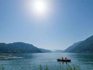 Enjoy a serene day on the lake with stunning mountain views.