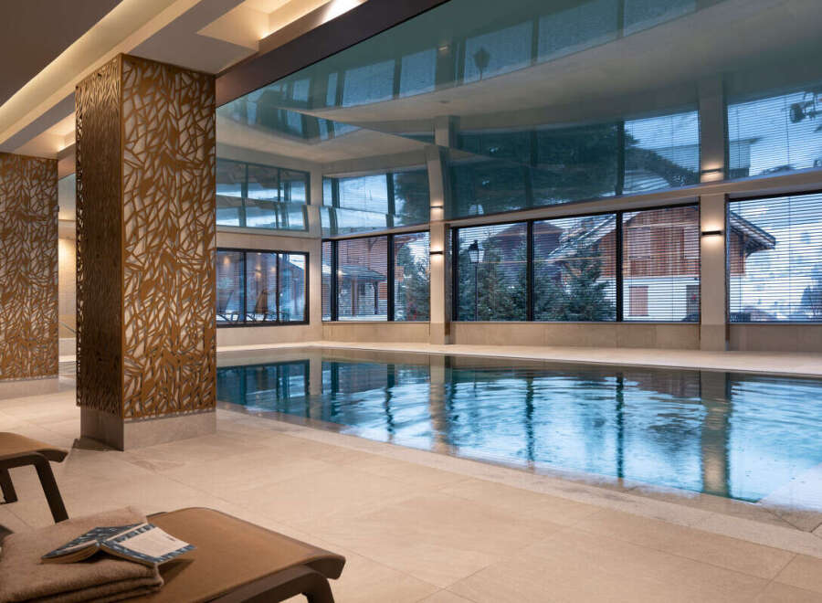 Indulge in the tranquility of our indoor pool, encased in natural light and featuring a stunning reflective ceiling.