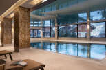 Indulge in the tranquility of our indoor pool, encased in natural light and featuring a stunning reflective ceiling.