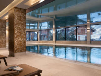 Indulge in the tranquility of our indoor pool, encased in natural light and featuring a stunning reflective ceiling.