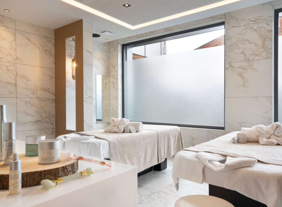 Indulge in pure relaxation at our luxurious spa, featuring two serene treatment rooms bathed in natural light.