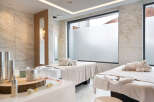 Indulge in pure relaxation at our luxurious spa, featuring two serene treatment rooms bathed in natural light.