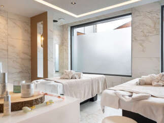 Indulge in pure relaxation at our luxurious spa, featuring two serene treatment rooms bathed in natural light.