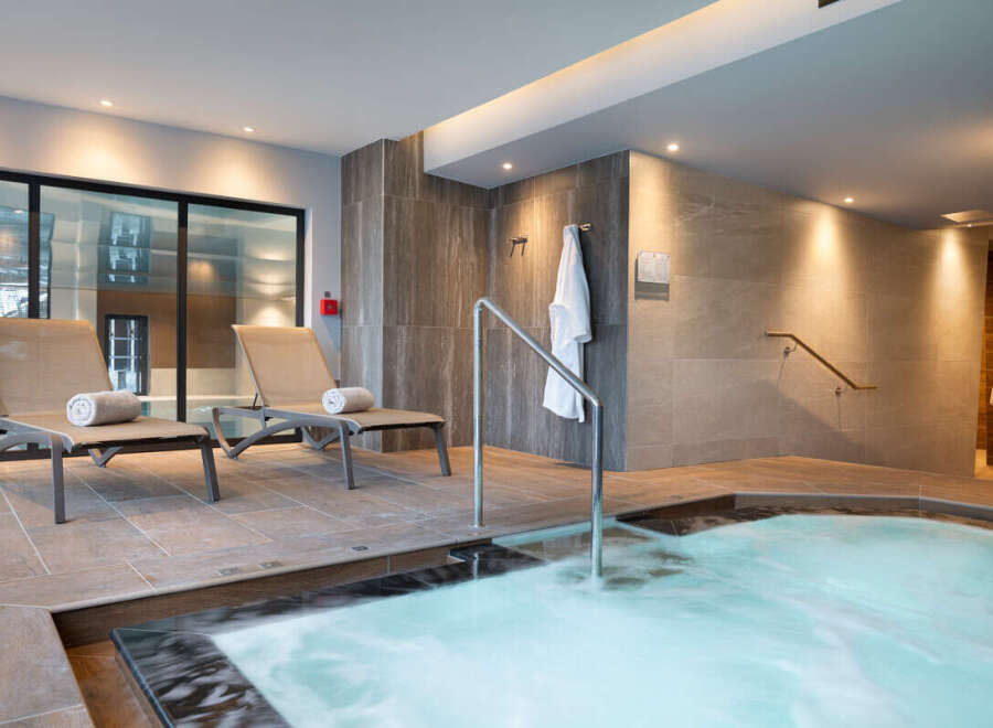 Relax and rejuvenate in our luxurious spa, featuring a soothing hot tub perfect for unwinding after a long day.