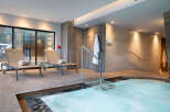 Relax and rejuvenate in our luxurious spa, featuring a soothing hot tub perfect for unwinding after a long day.