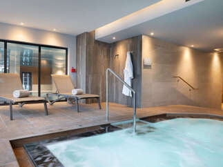 Relax and rejuvenate in our luxurious spa, featuring a soothing hot tub perfect for unwinding after a long day.