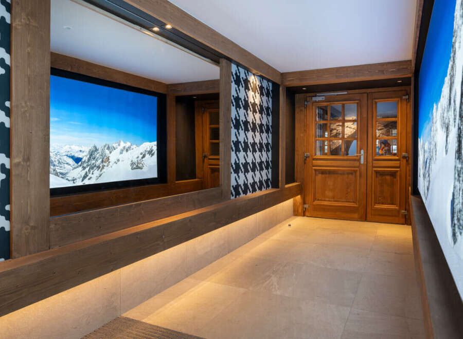 This stunning hallway boasts a built-in bench with integrated lighting, offering both style and functionality.