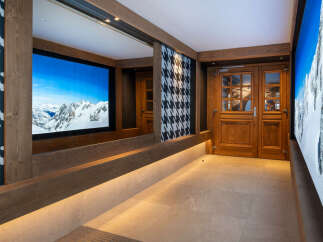 This stunning hallway boasts a built-in bench with integrated lighting, offering both style and functionality.