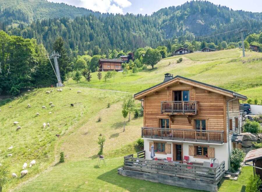 Mountain chalet with stunning views and large deck.