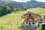 Mountain chalet with stunning views and large deck.