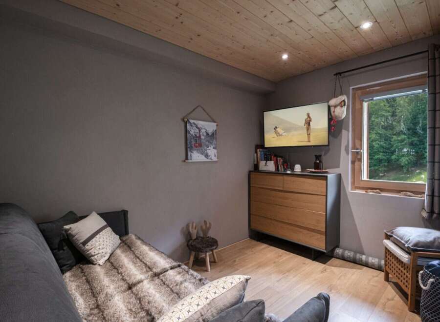 Cozy mountain chalet with a comfortable sofa bed, perfect for relaxing after a day of outdoor adventures.