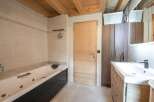This stunning bathroom boasts a luxurious jacuzzi tub, perfect for relaxation after a long day.