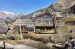 Discover a stunning mountain chalet nestled in a picturesque alpine setting.