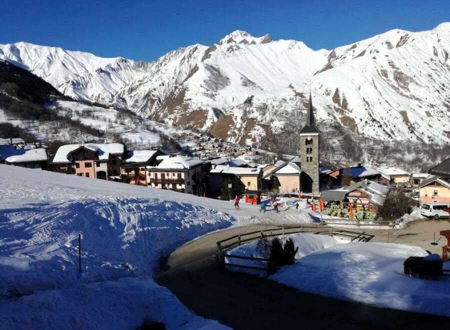 Experience the charm of a snow-covered village nestled in the heart of the mountains.