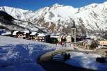 Experience the charm of a snow-covered village nestled in the heart of the mountains.