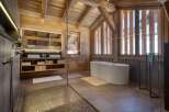 Experience rustic luxury in this stunning bathroom.