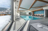 Indulge in the serene atmosphere of our indoor pool, surrounded by floor-to-ceiling windows offering breathtaking mountain views.