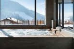 Luxury hotel hot tub with mountain views.