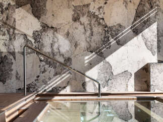Indulge in tranquility at this luxurious spa, featuring a stunning indoor pool with a glass bottom offering a unique perspective.