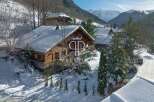 Discover a stunning chalet nestled in a picturesque winter wonderland.