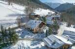 Discover a stunning chalet nestled in a picturesque snowy landscape.