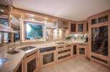This stunning kitchen boasts custom cabinetry and high-end appliances, perfect for culinary enthusiasts.