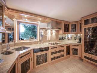 This stunning kitchen boasts custom cabinetry and high-end appliances, perfect for culinary enthusiasts.