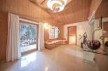 Experience luxury living in this stunning property, featuring a bright and airy interior with wooden accents.