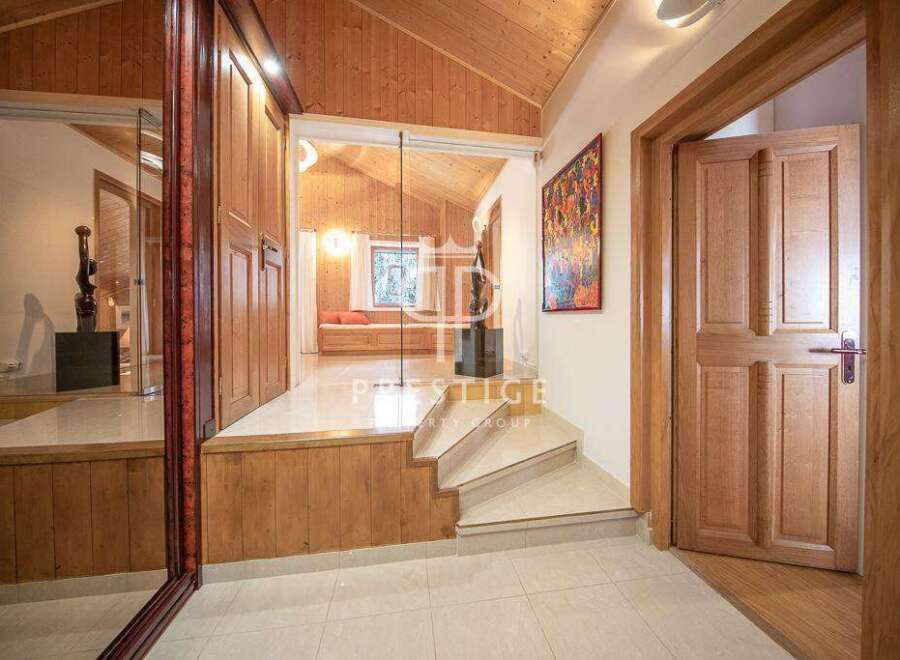 Step into luxury with this stunning property! Featuring a beautifully designed interior with wooden accents and a modern aesthetic.