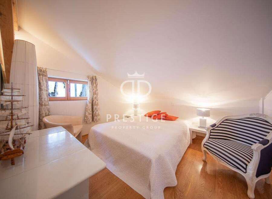 Discover a charming bedroom with a unique architectural design.