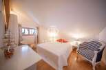 Discover a charming bedroom with a unique architectural design.