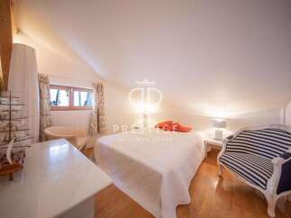 Discover a charming bedroom with a unique architectural design.