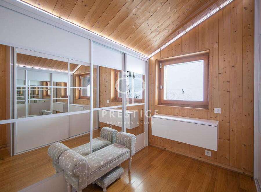 Discover the charm of this property featuring a cozy interior with wooden accents.