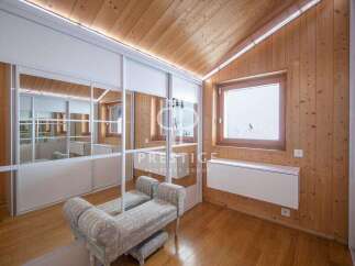 Discover the charm of this property featuring a cozy interior with wooden accents.