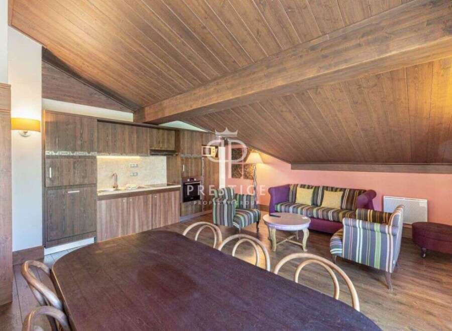 Discover the charm of this stunning property, featuring a cozy living area with a stylish sofa and armchairs.