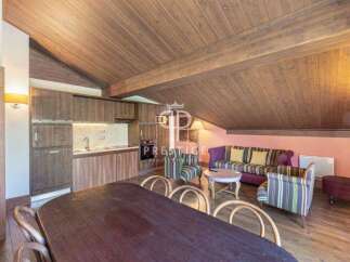 Discover the charm of this stunning property, featuring a cozy living area with a stylish sofa and armchairs.