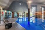 Indulge in luxury at this stunning property featuring a private indoor pool, perfect for year-round enjoyment.