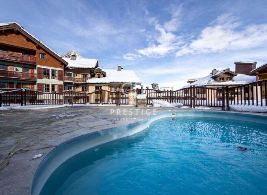 Discover a luxurious property with a stunning outdoor pool, perfect for relaxation.