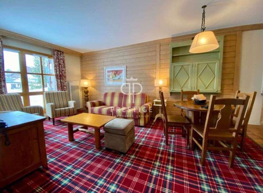 Step into a cozy living space with a charming, rustic aesthetic.