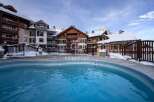 Experience luxury living in this stunning property, featuring a beautiful outdoor pool.