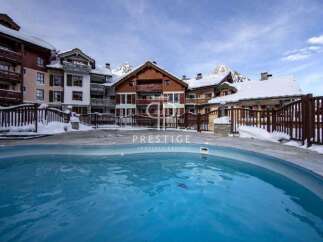 Experience luxury living in this stunning property, featuring a beautiful outdoor pool.
