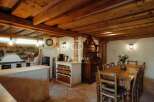 Discover rustic charm in this stunning property, featuring exposed wooden beams and a cozy ambiance.
