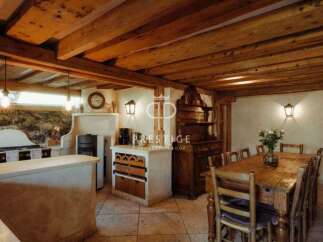Discover rustic charm in this stunning property, featuring exposed wooden beams and a cozy ambiance.