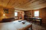 Experience rustic charm in this stunning property, featuring warm wooden interiors and a cozy ambiance.