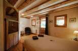Discover rustic charm in this cozy bedroom.