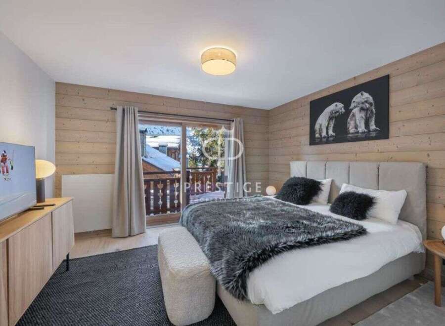 Experience luxury in this stunning bedroom with a cozy ambiance.