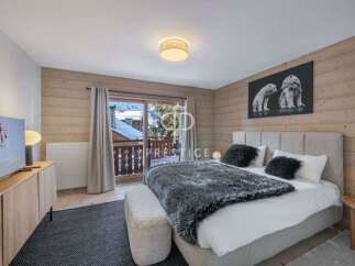 Experience luxury in this stunning bedroom with a cozy ambiance.