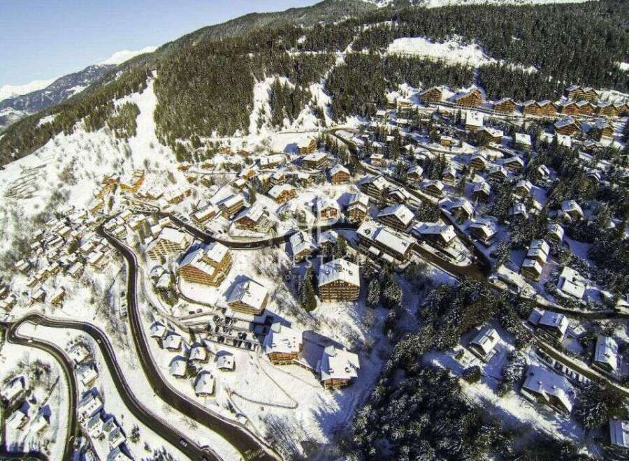 Discover a stunning mountain property nestled in a picturesque winter wonderland.
