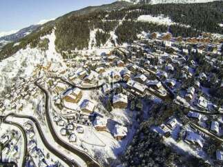 Discover a stunning mountain property nestled in a picturesque winter wonderland.